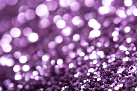 Violet glitter texture. Festive sparkling sequins background closeup. Luxury shiny walpaper for the day of St. Valentine, New Year, Unniversary celebration and Christmas Holidays.の写真素材