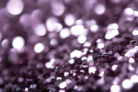 Violet glitter texture. Festive sparkling sequins background closeup. Luxury shiny walpaper for the day of St. Valentine, New Year, Unniversary celebration and Christmas Holidays.の写真素材