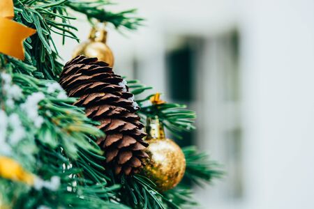 Merry christmas background. Green fir tree with golden balls and ribbon.の写真素材