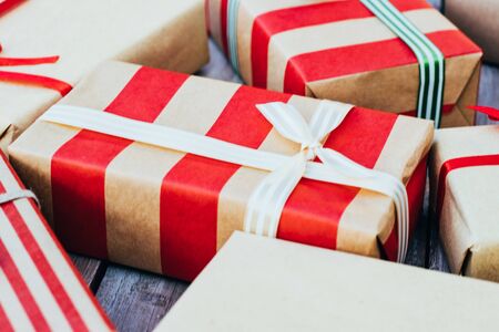 Christmas background with christmas gift boxes on the wooden board. New year walpaper.の写真素材