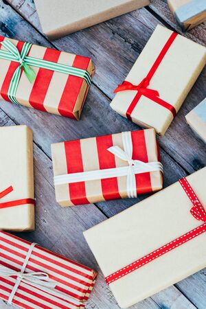 Christmas background with christmas gift boxes on the wooden board. New year walpaper.