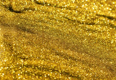 Glittering golden texture. New year background.の写真素材