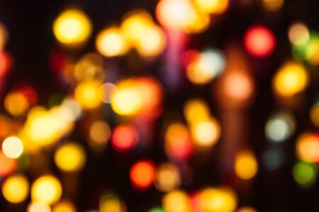 Christmas holiday golden lights bokeh background. New Year blurry walpaper.
