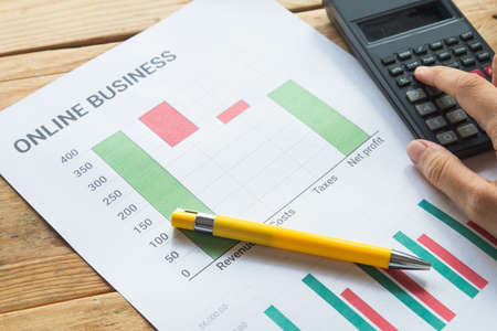 Young business busy working, entrepreneur analyzing financial information as graphicsの写真素材