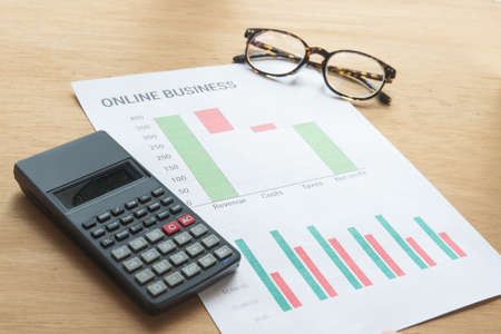 Young business busy working, entrepreneur analyzing financial information as graphicsの写真素材