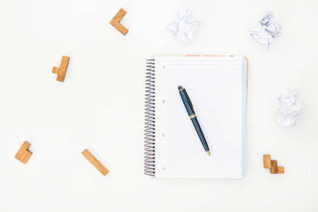 Puzzle, pencil, notebook and crumpled paperの写真素材