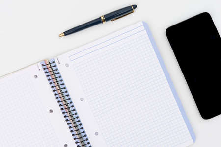 notebook with pencil and mobileの写真素材