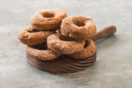 Homemade donuts sugar glazed on a stone backgroundの写真素材