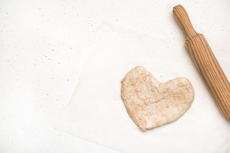 heart-shaped pizza for a special eveningの写真素材