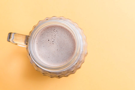 drink chocolate top view in yellow background