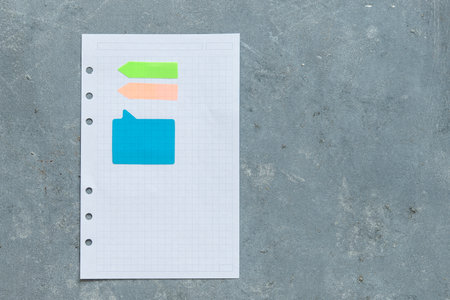 Note book and note paper on a grown background