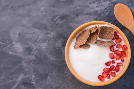 Natural Yogurt with granadine (healthy breakfast)の写真素材