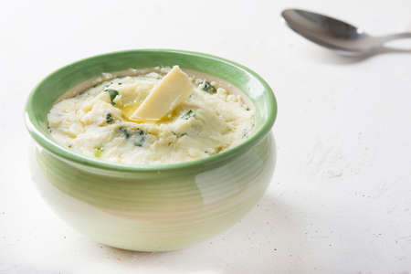 Mashed potatoes in green bowl close upの写真素材