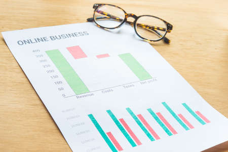 Young business busy working, entrepreneur analyzing financial information as graphicsの写真素材