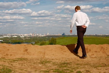 A business man walking outside.の写真素材