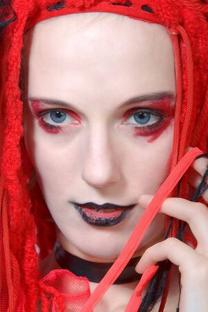 The sad pretty woman in redの写真素材