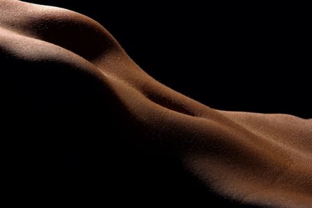 The  woman poising in the dark. Female body parts.の写真素材