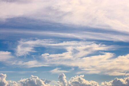 Dramatic cloud scape. White clouds in a blue sky.