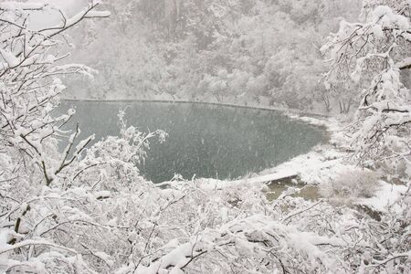 Snowstorm on Plitvice lake in Croatiaの写真素材