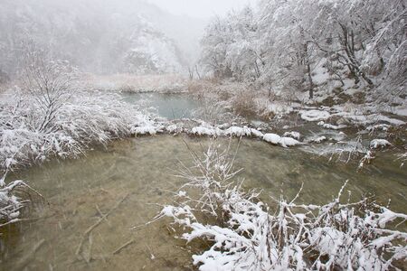 Snowstorm on Plitvice lake in Croatiaの写真素材