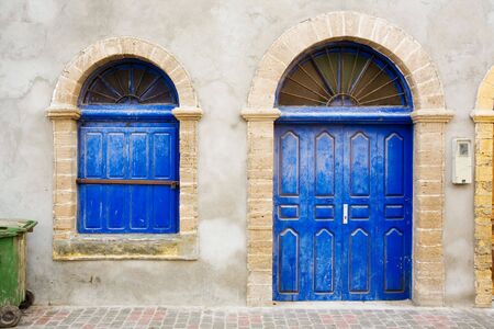Old blue door decorated with iron detailの写真素材