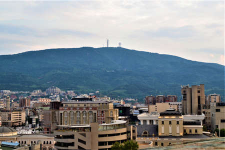 Skopje city view from Ottoman Castle..Skopje buildings in city Center and huge cross in Vodno Mountainのeditorial素材