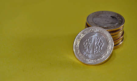 Money and currency of Turkey. Money and Groups of One Turkish Lira coins together. Isolated...