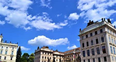 Prague and Czech Republic during sunny day. Top of the ancient buildings in Prague together with blue sky and white cloud background.の写真素材