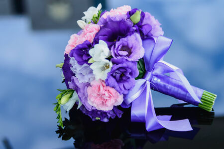 wedding bouquet on a glass tableの写真素材