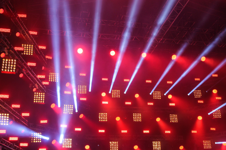 Searchlights on the stage with the rays of light coming from themの写真素材