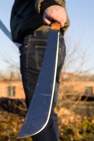 Blade machete in hand