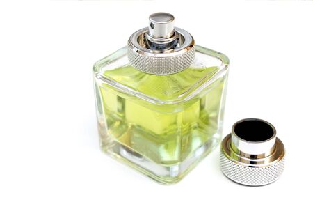 Bottle of fragrant perfume in green on a white background with an open lidの写真素材