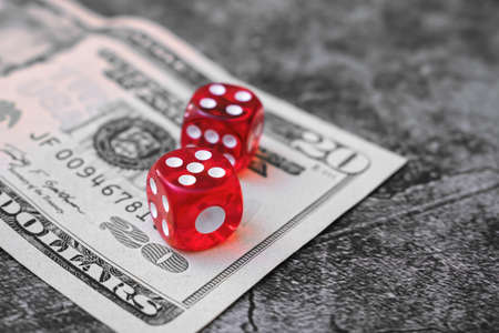 The dice are on the banknote in the casino. Money rate in gamblingの写真素材