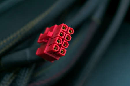 Red plug or connector from a power supply for motherboards of a personal computerの写真素材