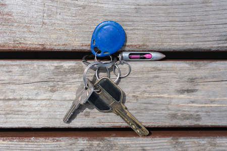 Regular bunch of keys with a key fob for unlocking the doors of the houseの写真素材