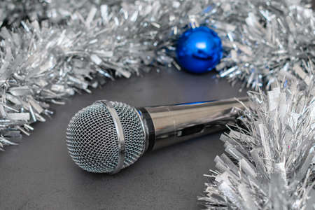 Silver music microphone and silver Christmas tinsel for Christmas party