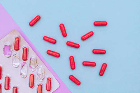 Medicines in red capsules for weight loss and treatment.の写真素材