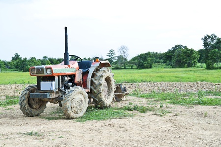 dirty tractor on farm