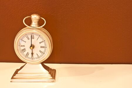 Vintage clock on table.