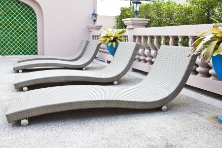 Beach chairs side swimming pool の写真素材
