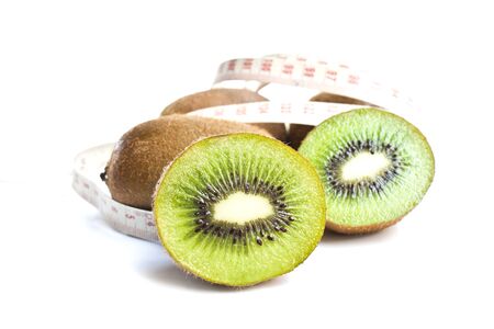 kiwi fruit isolated with measure tapeの写真素材