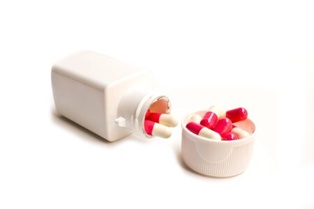 Pills from bottle on the whiteの写真素材