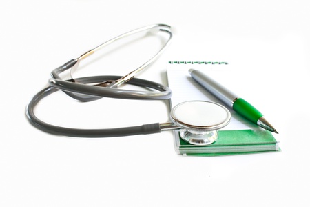 Stethoscope and note isolated in whiteの写真素材