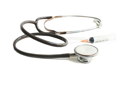Stethoscope and syring on white background.の写真素材