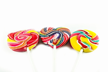 Colorful spiral lollipop lolly pop on a white background の写真素材