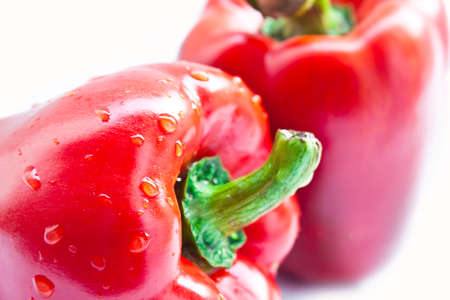 Closed-up red fresh sweet pepper isolated on white background の写真素材