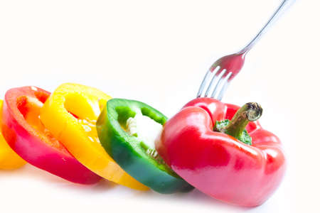 Sliced peppers isolated on whiteの写真素材