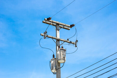 electricity post on blue skyの写真素材