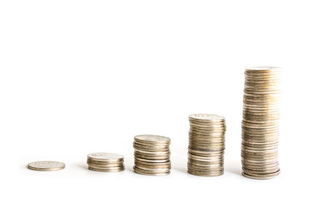 Savings, increasing columns of coins isolated on white background