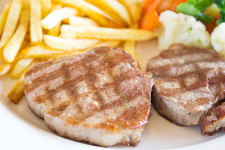 Grilled steaks and vegetableの写真素材